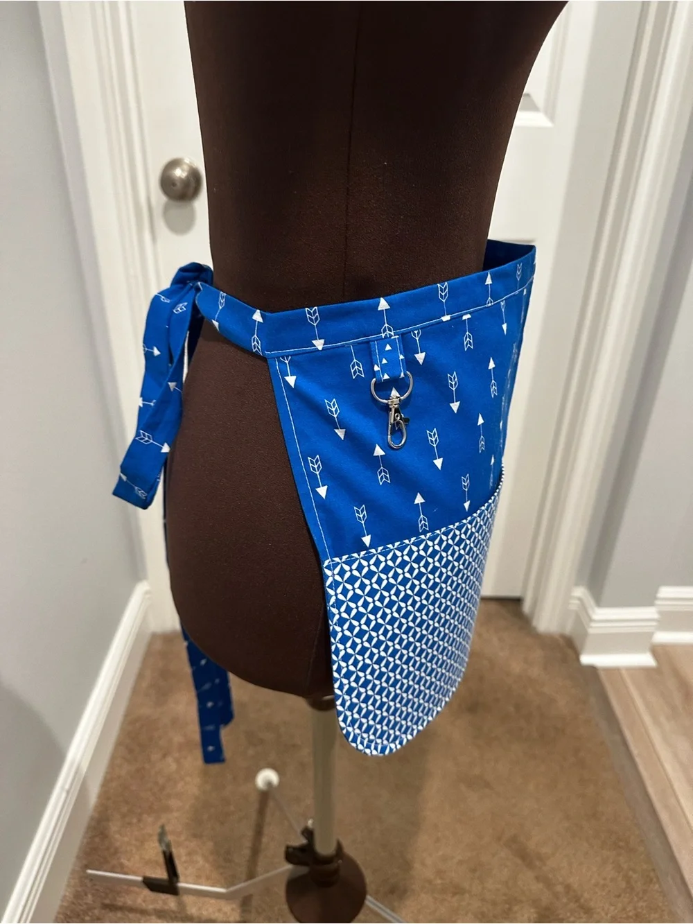 Blue Patterned Apron with Pockets across the front and a Snap Pocket